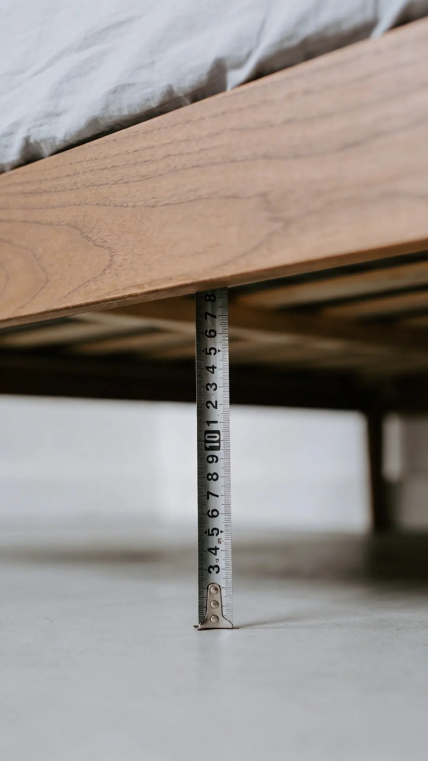 tape measure under bed frame, measuring clearance height