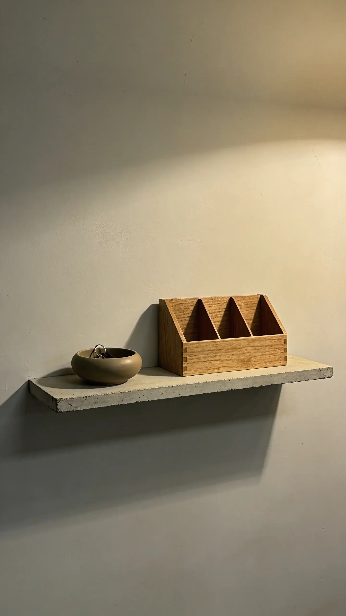 Narrow floating shelf with key bowl and mail sorter